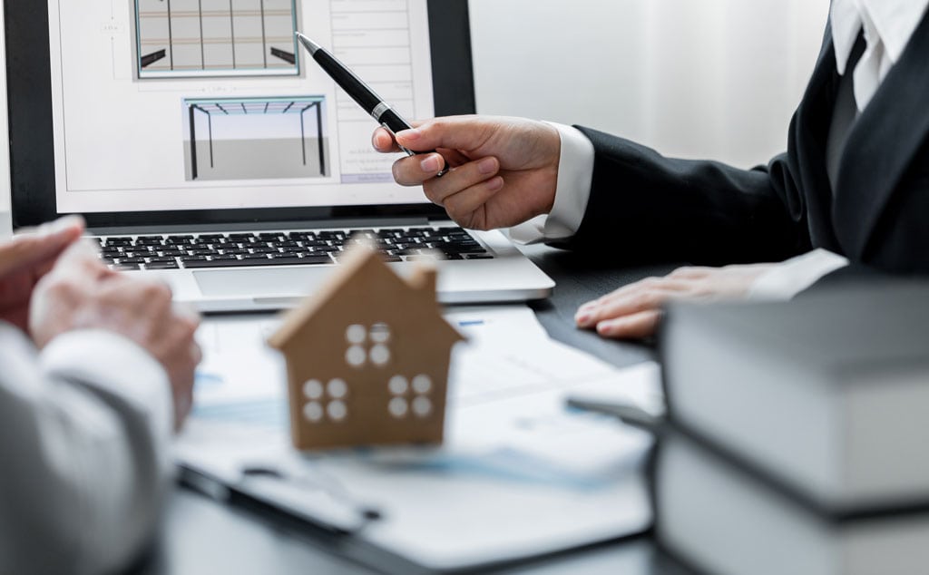 Close up of businesswomen advising blueprint building houses to